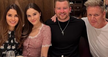 Holly Ramsay (pictured, second left) is pictured enjoying a meal with her fiance Adam Peaty (pictured, second right) and her parents Tana (far left) and Gordon (far right)