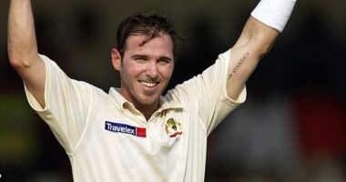 Australia's Damien Martyn raises his bat and helmet after scoring a century against India during the first day of third cricket test match in Nagpur, India, Tuesday, Oct 26, 2004. (AP Photo/Aman Sharma)