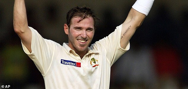 Australia's Damien Martyn raises his bat and helmet after scoring a century against India during the first day of third cricket test match in Nagpur, India, Tuesday, Oct 26, 2004. (AP Photo/Aman Sharma)
