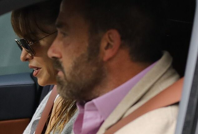 Ben Affleck was spotted picking up a glamorous mystery woman on Wednesday as he rode around Los Angeles in his gleaming BMW