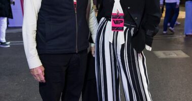 Catherine Zeta-Jones, 56, and husband Michael Douglas, 81, twinned in chic monochrome ensembles as the Wednesday actress opted to elongate her legs with bold striped trousers