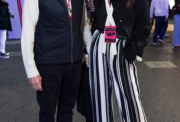 Catherine Zeta-Jones, 56, and husband Michael Douglas, 81, twinned in chic monochrome ensembles as the Wednesday actress opted to elongate her legs with bold striped trousers