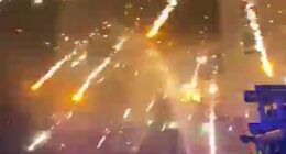 Emergency services duck for cover as fireworks explode overhead in Liverpool on Bonfire Night after being thrown by thugs
