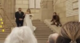 A wedding planner appeared to upstage a bride on her big day by sliding down the stairs