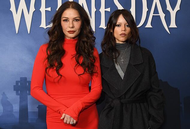 Catherine Zeta-Jones (L) looked almost as young as her onscreen daughter Jenna Ortega (R) while posing together Tuesday at a FYC event in Midtown Manhattan for their hit Netflix show, Wednesday