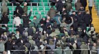 Celtic fans turn their back and make gestures during the minute's silence to mark the war dead