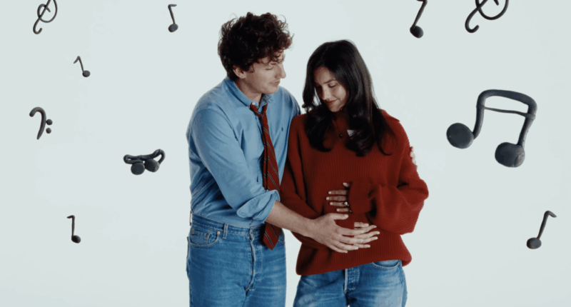 Charlie Puth holds wife's pregnant belly