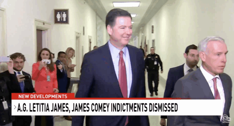 Former FBI Director smiles as he walks down the hall.