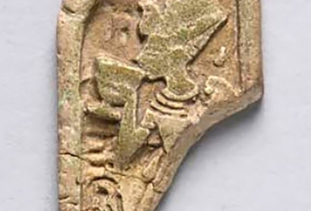 The artifact, labeled ECM 1887, depicts King Tut drinking from a white lotus cup while wearing a blue crown with a cobra on it, a wide necklace, bracelets, armbands and a detailed pleated kilt