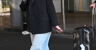 Delta Goodrem was spotted touching down in Sydney looking effortlessly chic alongside husband Matthew Copley