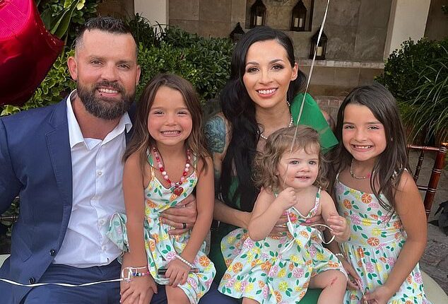Christopher Scholtes, left, was reported to have died on Wednesday - the day he was due to report to prison for murdering daughter Parker (pictured second from right on mother Erika's knee) in a hot car