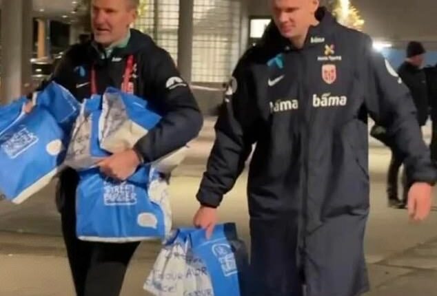 Erling Haaland incredibly celebrated guiding Norway to the brink of next summer's World Cup by collecting an estimated 70 cheeseburgers for his team-mates