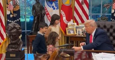Trump introduces himself to one of the young children as 'Donald'