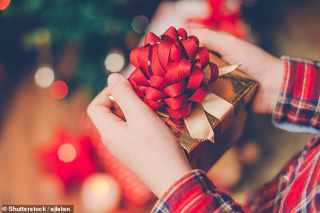 A mom has sparked a fierce debate after she revealed she wasn't buying anything new for her kids for Christmas this year in a bid to 'lower her contribution to consumerism' (stock image)