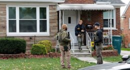 Members of the FBI Joint Terrorism Task Force search a home in Dearborn, Michigan, on Friday