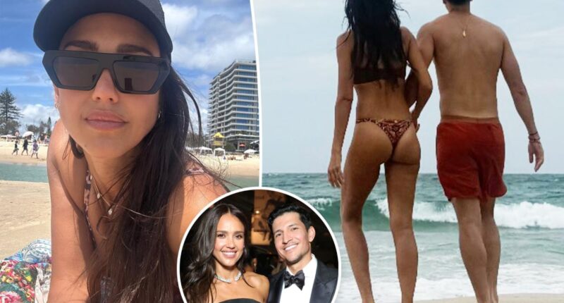 Jessica Alba rocks thong bikini on beach with Danny Ramirez