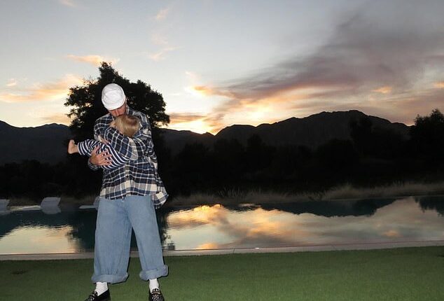 Justin Bieber kissed his mini-me son Jack Blues while poolside at his $16.6 million seven-bedroom mansion located inside The Madison Club in La Quinta, California on Thursday