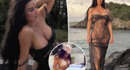 Kim Kardashian wears sheer lace dress on the beach
