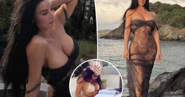 Kim Kardashian wears sheer lace dress on the beach