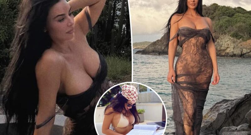Kim Kardashian wears sheer lace dress on the beach