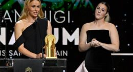 Mary Earps (right) has said that Hannah Hampton's 'bad behaviour' was rewarded in her new autobiography. Pictured watching her Lionesses rival winning the Women's Yashin Trophy