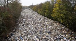 The 20ft-high pile of hazardous rubbish was illegally dumped in a field next to the A34 and River Cherwell near Kidlington in Oxfordshire