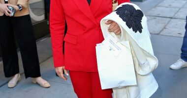 Representative Marjorie Taylor Greene leaving 'The View' in red pant suit in New York City on Tuesday. A recent report indicates that she wants to run for president in 2028