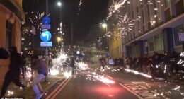 Footage shows fireworks being set off in the city centre as police battle to regain control amidst scenes of chaos and disruption