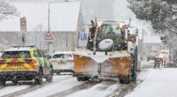 Traffic battles though as heavy snow falls at Kingussie in the Scottish Highlands on Tuesday morning
