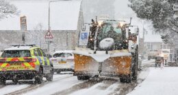 Traffic battles though as heavy snow falls at Kingussie in the Scottish Highlands on Tuesday morning