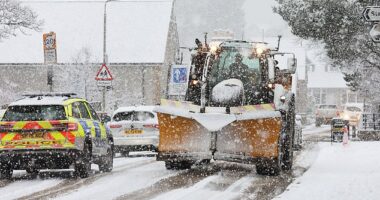 Traffic battles though as heavy snow falls at Kingussie in the Scottish Highlands on Tuesday morning