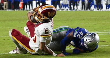 NFL star Jayden Daniels suffers gruesome arm injury... and angry Commanders fans blame their coach