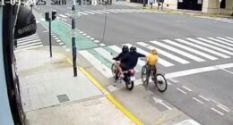 New footage shows the moment a phone thief was hit by instant karma after trying to steal a phone from a tourist - seeing bystanders rush to her aid