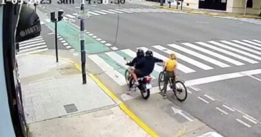 New footage shows the moment a phone thief was hit by instant karma after trying to steal a phone from a tourist - seeing bystanders rush to her aid