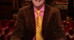 Do you use the phrase 'siblings' or 'the countryside'? Or maybe you love watching Celebrity Gogglebox or are a fan of Stephen Fry (pictred)? Well, according to socialite Nicky Haslam, 86, these are just some of the signs that mark you as distinctly common in 2025