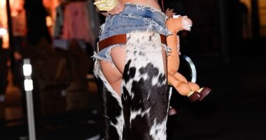 Olivia Attwood, 34, cheekily displayed her bottom as she dressed up as Toy Story's Jessie at Heidi Klum 's legendary Halloween party in New York on Friday