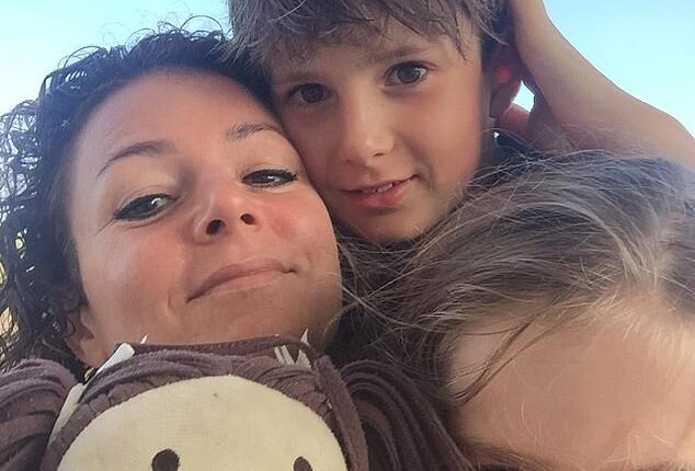 Family psychologist Dr Jo Stuart is pictured here with her two young children. She told the Daily Mail that modern employment requires parents to 'function like machines' and cautioned carers to implement rest periods or risk dire consequences to their mental health