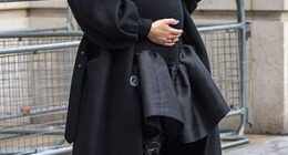 The expectant mother cradled her bump