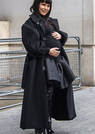 The expectant mother cradled her bump