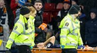 Premier League star in tears as he's taken off on a stretcher in Scotland's crucial World Cup qualifier against Denmark