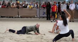 The Prince of Wales takes part in a game of volleyball with players from the Levante Institute, a local beach volleyball school, at Copacabana Beach in Rio de Janeiro