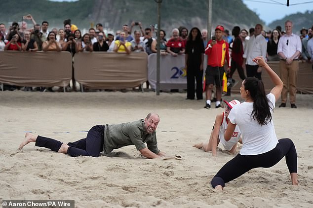 The Prince of Wales takes part in a game of volleyball with players from the Levante Institute, a local beach volleyball school, at Copacabana Beach in Rio de Janeiro