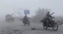 Haunting footage has emerged showing Russian troops advancing through thick fog in a convoy of wrecked cars, many missing doors and windows, in scenes likened to Mad Max