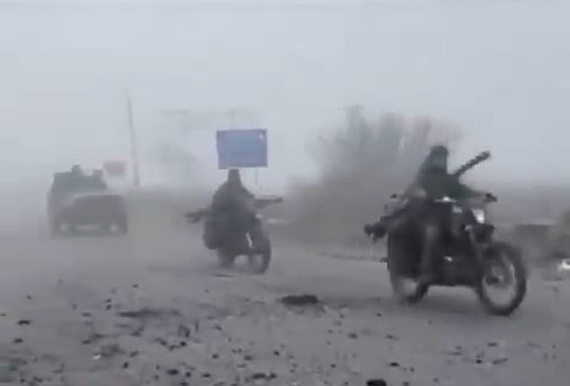 Haunting footage has emerged showing Russian troops advancing through thick fog in a convoy of wrecked cars, many missing doors and windows, in scenes likened to Mad Max