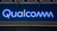 Qualcomm takes a big tax charge that hits earnings, and the stock falls