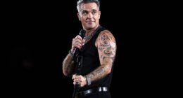 Robbie Williams has admitted to a disgusting act he does on stage while performing for thousands of fans