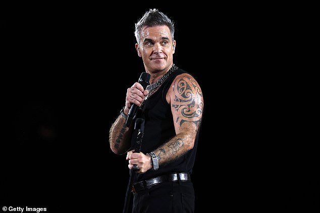 Robbie Williams has admitted to a disgusting act he does on stage while performing for thousands of fans