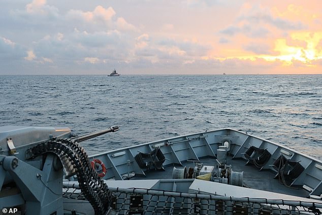 The deck of the HMS Severn looks out toward the Russian corvette RFN Stoikiy off the UK coast