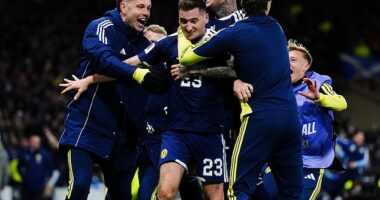 Kenny McLean is mobbed after grabbing a stunning fourth and final goal at Hampden