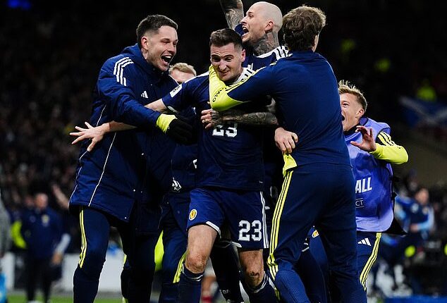 Kenny McLean is mobbed after grabbing a stunning fourth and final goal at Hampden
